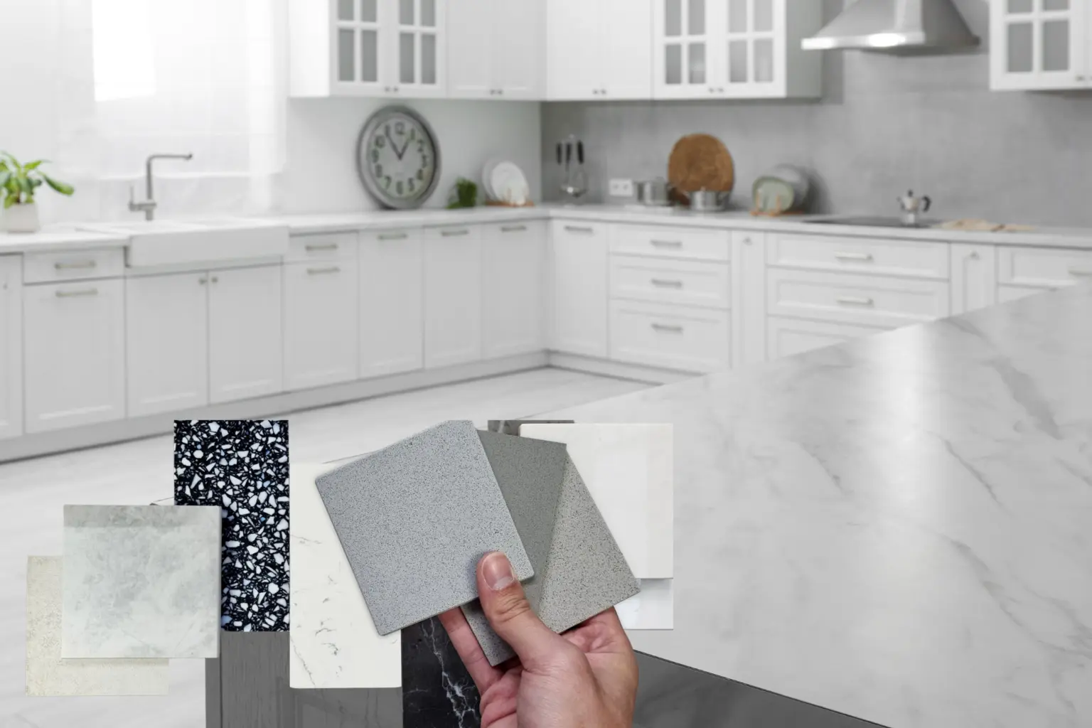 Countertop samples compared on a finished kitchen surface