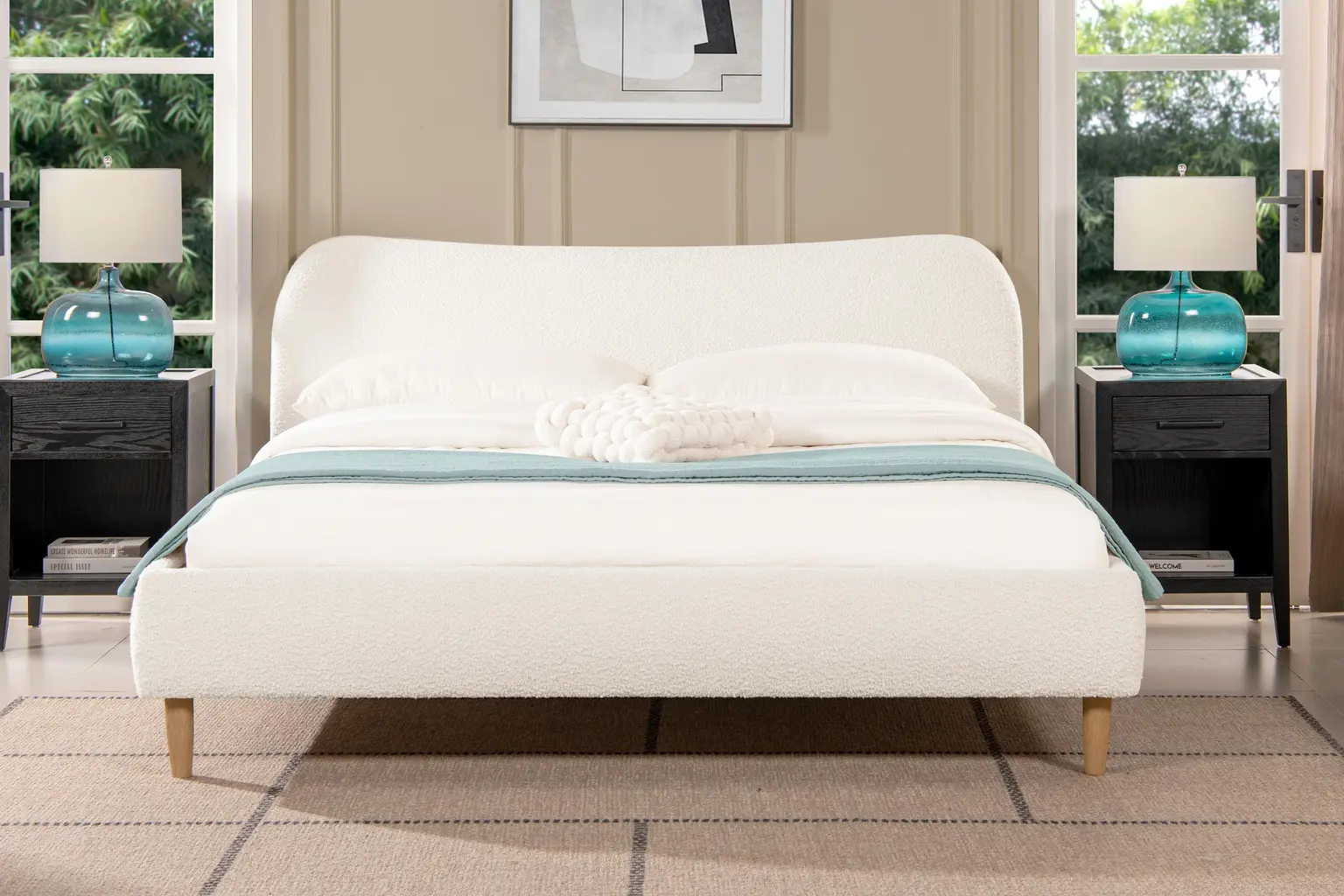 Ashley Roman ivory bouclé platform bed with a softly curved headboard