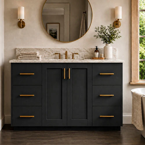 Dark bathroom vanity with brass hardware, stone countertop, and round mirror