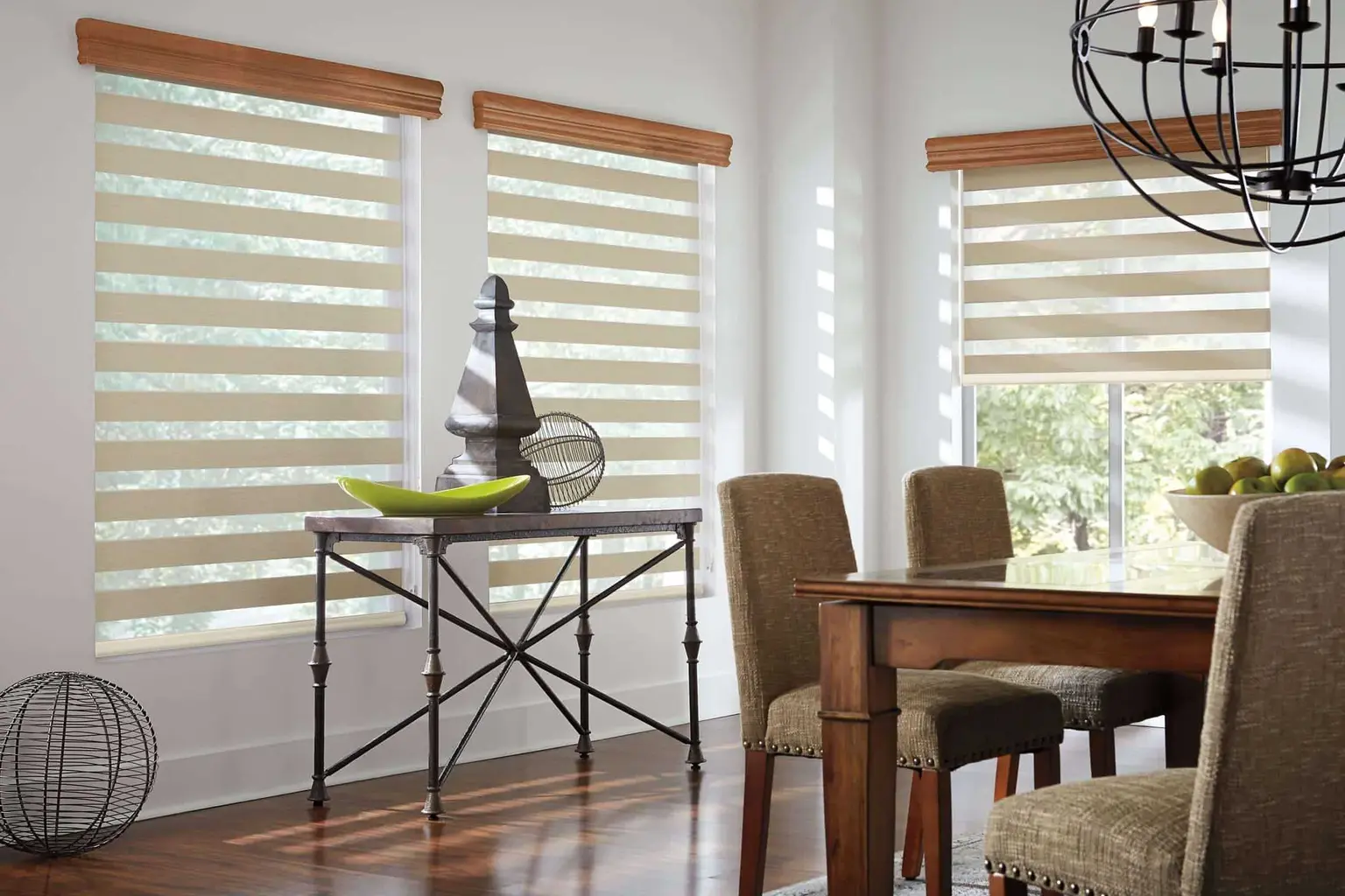 MarQi zebra shades fitted across the windows of a dining room